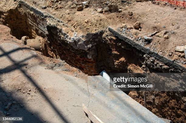 trench dug in a road - trench stock pictures, royalty-free photos & images