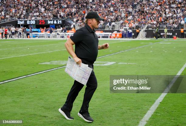 Head coach John Gruden of the Las Vegas Raiders leaves the field after the first half against the Chicago Bears at Allegiant Stadium on October 10,...