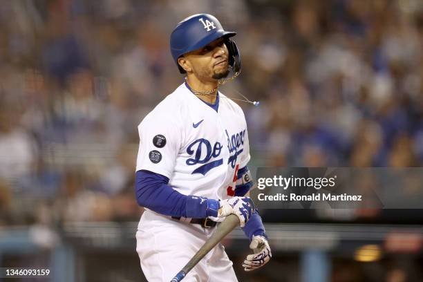 Mookie Betts of the Los Angeles Dodgers reacts after striking out against the San Francisco Giants in game 3 of the National League Division Series...