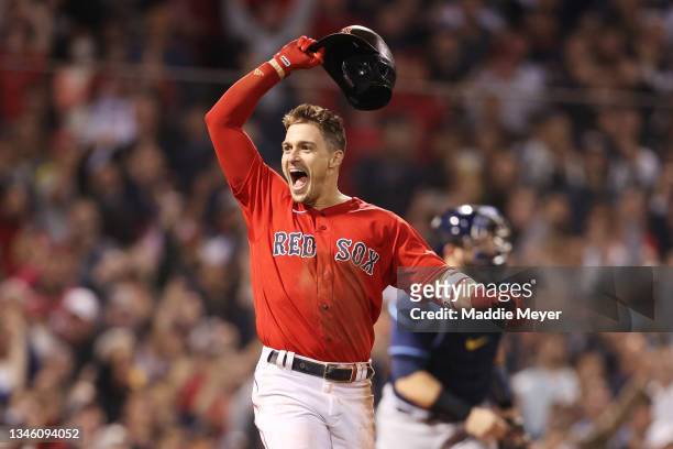 Enrique Hernandez of the Boston Red Sox celebrates his game winning sacrifice fly in the ninth inning against the Tampa Bay Rays during Game 4 of the...