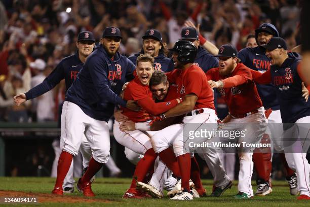 Enrique Hernandez of the Boston Red Sox celebrates his game winning sacrifice fly with teammates in the ninth inning against the Tampa Bay Rays...