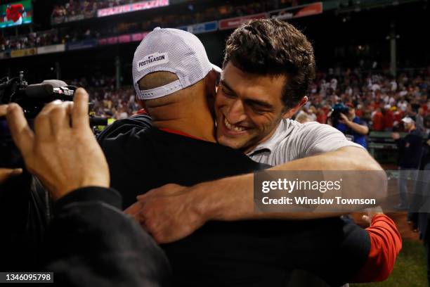 Chief Baseball Officer for the Boston Red Sox Chaim Bloom hugs Alex Cora after their 6 to 5 win over the Tampa Bay Rays during Game 4 of the American...