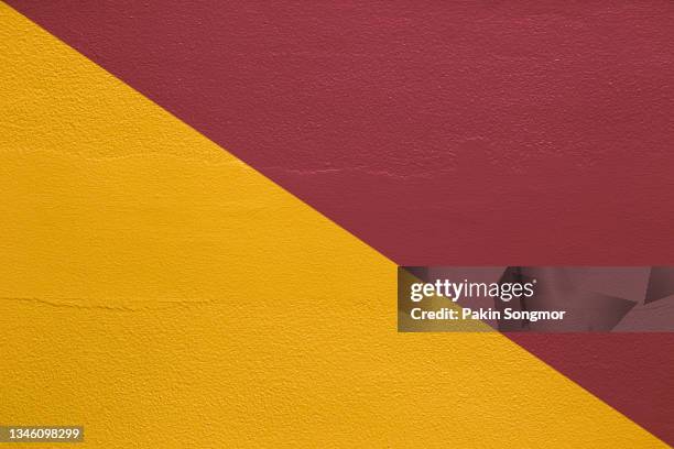 yellow and red, two tone color old grunge wall concrete texture as background. - two tone photos et images de collection