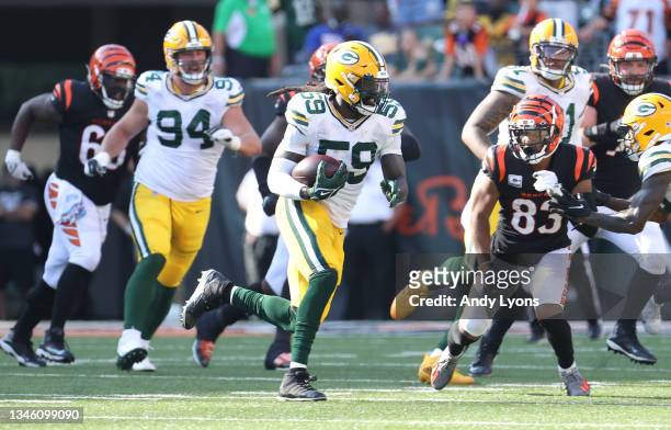 De'Vondre Campbell of the Green Bay Packers runs with the ball after intercepting a pass against the Cincinnati Bengals at Paul Brown Stadium on...