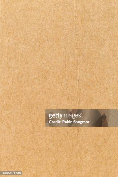 brown eco recycled kraft paper sheet texture cardboard background. - kraft paper stockfoto's en -beelden