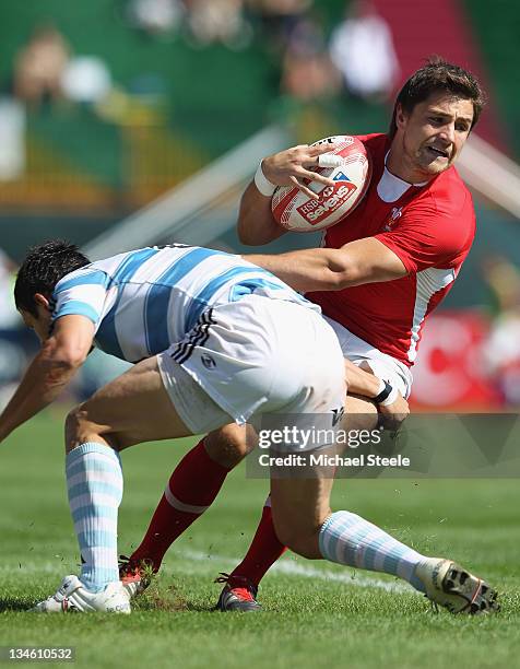 Alex Walker of Wales is held up by Gonzalo Gutierrez Taboada of Argentina during the Quarter Final match between Argentina and Wales during Day Three...