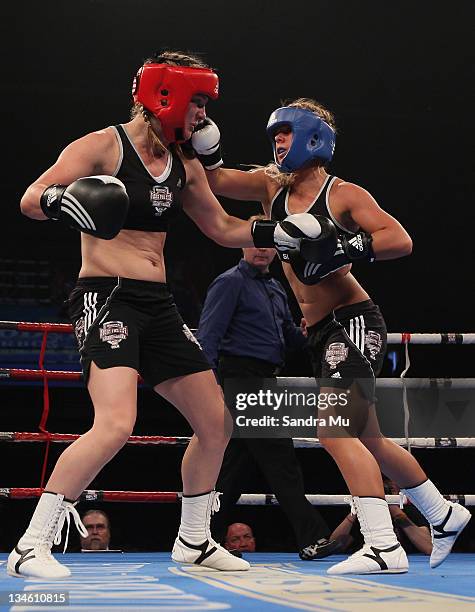 Paige Hareb punches Hayley Holt during the Fight For Life League vs Union Night at The Trusts Stadium on December 3, 2011 in Auckland, New Zealand.