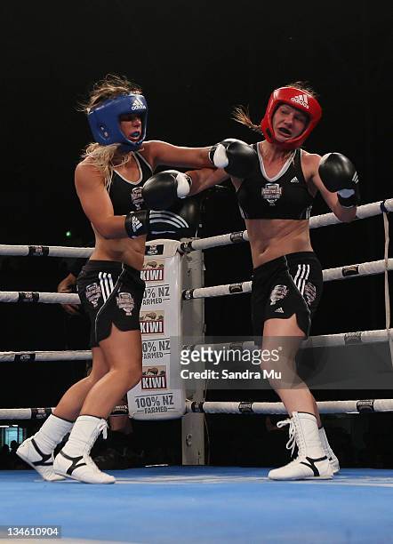 Paige Hareb punches Hayley Holt during the Fight For Life League vs Union Night at The Trusts Stadium on December 3, 2011 in Auckland, New Zealand.