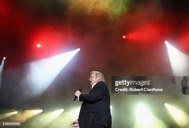 John Farnham performs on stage as part of the Race By Day Rock All Night Concert series at the ANZ Stadium on December 3, 2011 in Sydney, Australia.