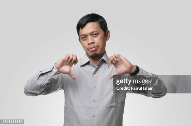 young men gesturing sign language - lower fotografías e imágenes de stock