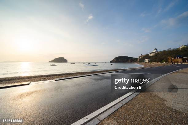 coastal road at sunrise - wet asphalt stock pictures, royalty-free photos & images