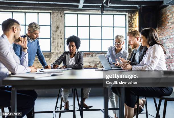 large group of entrepreneurs working on different things in the office. - company culture stock pictures, royalty-free photos & images