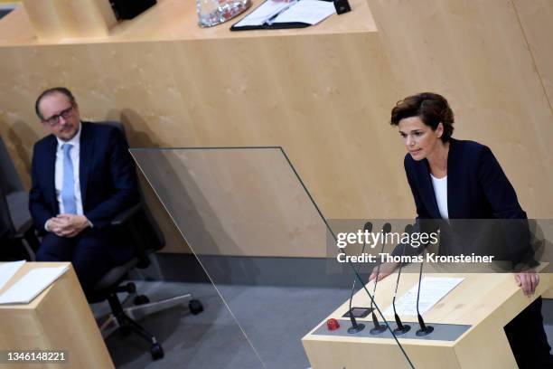 Head of the Austrian Social Democratic Party Pamela Rendi-Wagner speaks as newly appointed Austrian chancellor Alexander Schallenberg watches during...