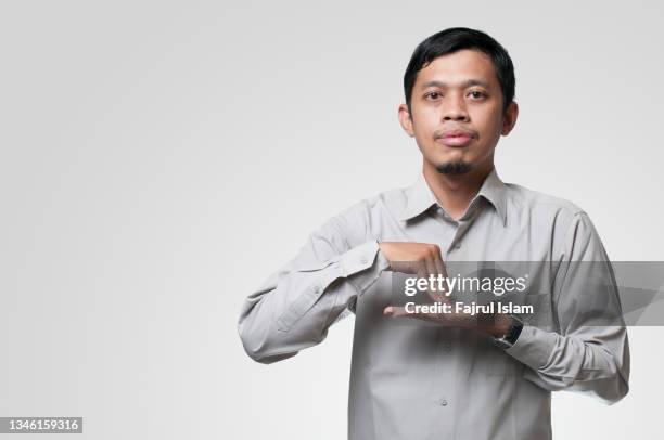 young men gesturing sign language - langue photos et images de collection