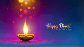 Happy diwali vector illustration. Festive diwali card. Design template with lamp, golden lights, colorful background. Blue magenta background, mandala. Vector holiday illustration
