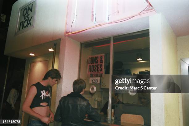 Fans line up to buy tickets to see the rock group 'Guns n' Roses' perform their third sold out show at the Roxy Theatre on January 18, 1986 in Los...