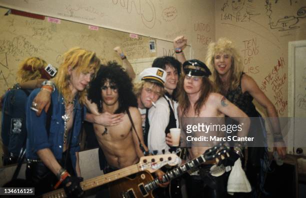 Duff McKagan, Slash, Izzy Stradlin, Axl Rose and Steven Adler of the rock group 'Guns n' Roses' pose for a portrait backstage on a night when they...