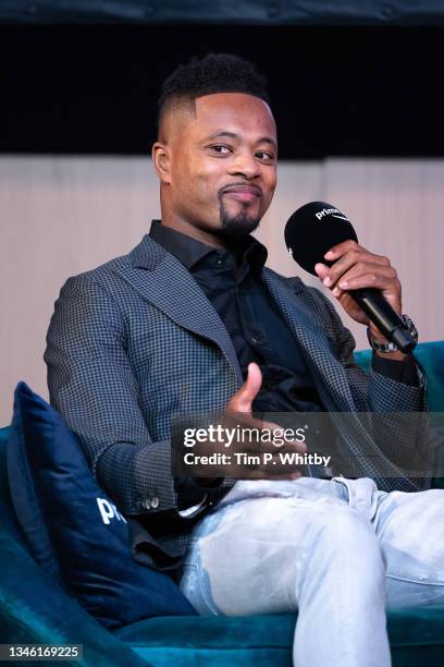 Patrice Evra speaking with Gabby Logan on stage at the 'Prime Video Presents Sport' event at Pan Pacific on October 12, 2021 in London, England. At...