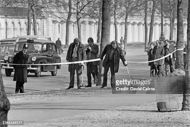 Police searching the Mall for bullets near Buckingham Palace in London, after an attempt was made to kidnap Princess Anne, the Princess Royal, a few...