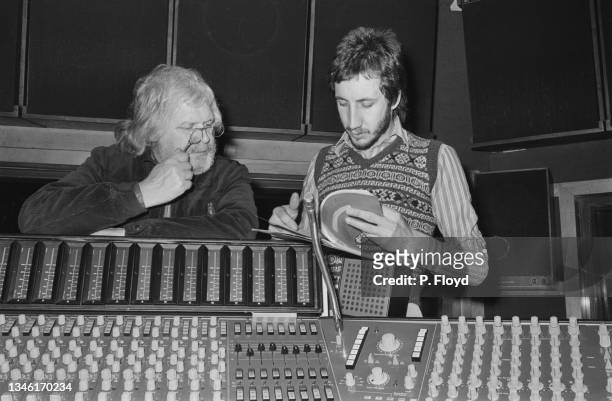 English film director Ken Russell and musician Pete Townshend of rock band the Who in a recording studio during the making of the band's rock opera...
