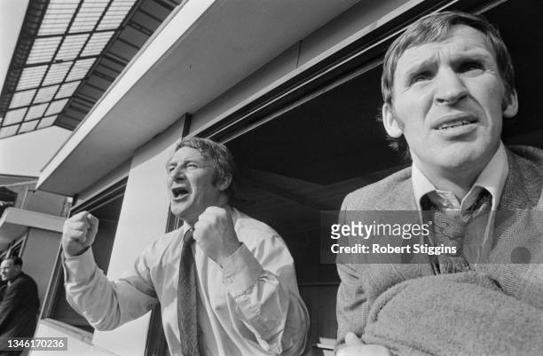 Tommy Docherty , manager of Manchester United, watches a League Division One match against Chelsea at Stamford Bridge in London, UK, 30th March 1974....
