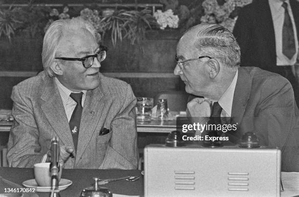 British Labour politician Michael Foot , the Secretary of State for Employment, with trade union leader Hugh Scanlon , President of the Amalgamated...