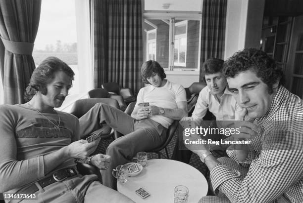 The England football team relax after training, UK, 10th May 1974. From left to right, Frank Worthington, Malcolm MacDonald, Roy McFarland and Peter...