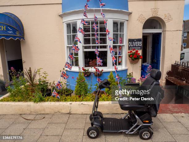 Mobility scooter outside a Bed and Breakfast along the esplanade on June 25,2021 in Weymouth, England.