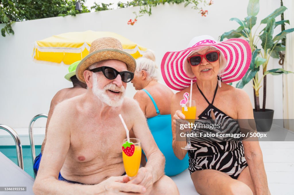 Senior Pool Fun Group Of Seniors Having Fun Together At Swimming Pool High-Res Stock ...