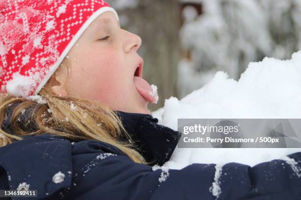 close-up of girl sticking out tongue during winter,gatlinburg,tennessee,united states,usa - gatlinburg winter stock pictures, royalty-free photos & images