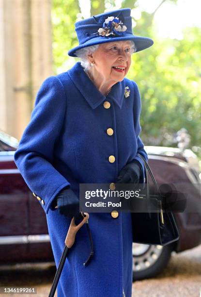 Queen Elizabeth II seen using a walking stick as she arrives for a Service of Thanksgiving to mark the centenary of The Royal British Legion at...