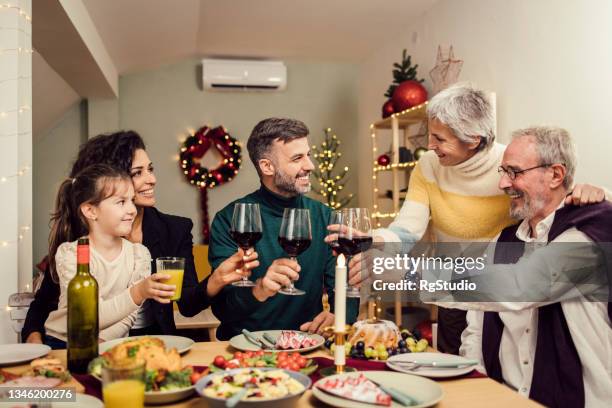 happy family ew year's eve and toasting with wine - ew stock pictures, royalty-free photos & images