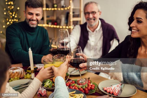 happy family toasting for the new year - 39 year old stockfoto's en -beelden