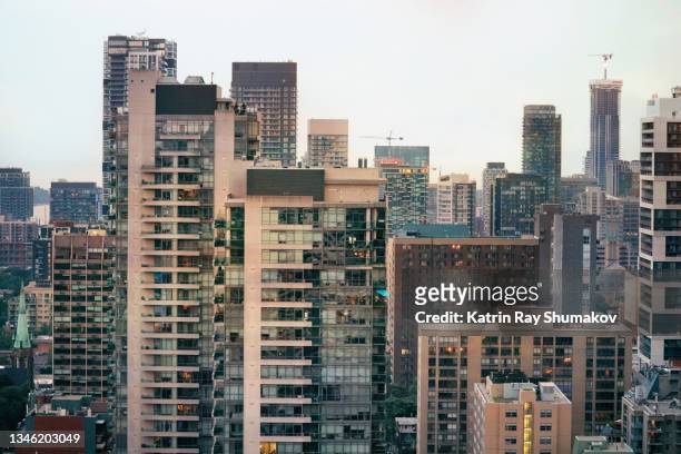concrete jungles of growing city - toronto condo stock pictures, royalty-free photos & images