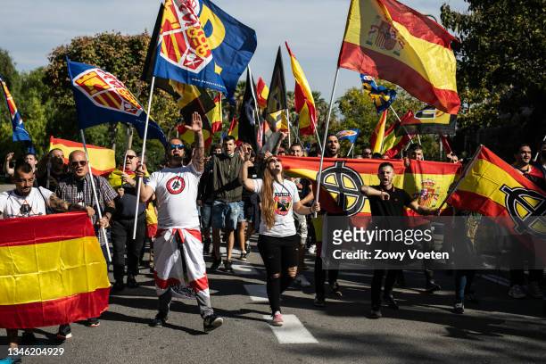 Person makes the Nazi salute at the alternative far-right demonstration on Spain's national day with the slogan "Glory and honour to our heroes of...
