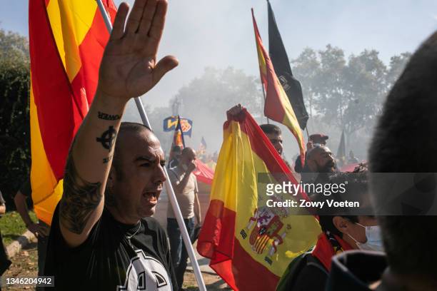 Right-wing extremist sympathisers give Nazi salutes at alternative demonstration to Spain's National Day on October 12, 2021 in Barcelona, Spain....