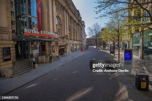 General view of an empty street outside the Royal Exchange on Cross Street in central Manchester during the Covid-19 lockdown on March 25, 2020 in...