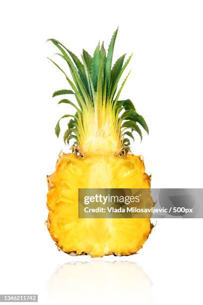 close-up of halved pineapple against white background - half photos et images de collection