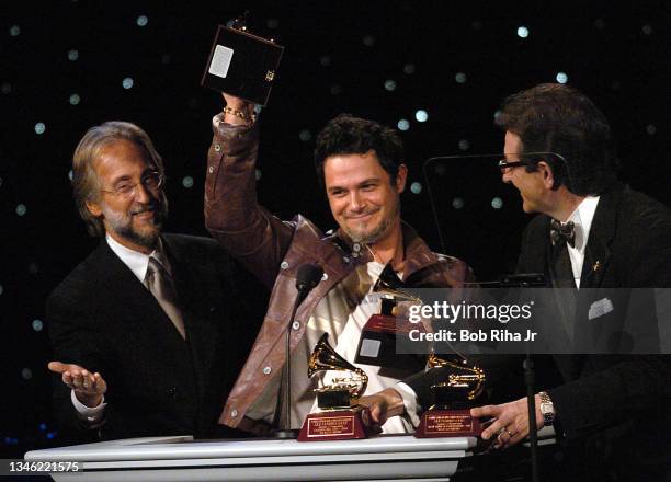 Alejandro Sanz from Spain accepts his 2004 Grammy Awards from Neil Portnow and Gabriel Abaroa during Childrens Hospital Los Angeles Gala, October 2,...