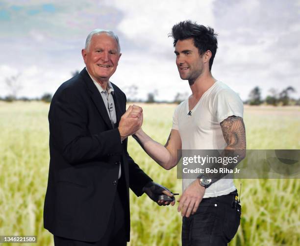 Maroon 5 singer Adam Levine shakes hands with Intel Chairman Craig Barrett at the International Consumer Electronics Show , January 9, 2009 in Las...