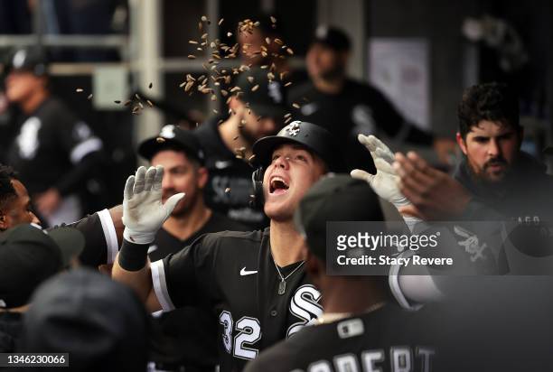 Gavin Sheets of the Chicago White Sox is congratulated by teammates in the dugout after hitting a solo home run during the 2nd inning of Game 4 of...