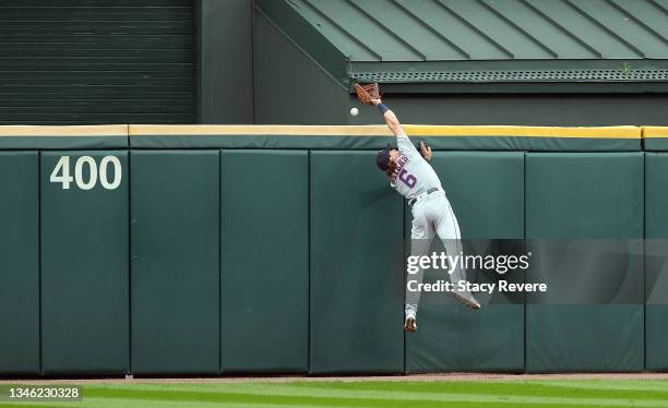 Jake Meyers of the Houston Astros hits the outfield wall while trying to catch a fly ball off the bat of Gavin Sheets of the Chicago White Sox during...