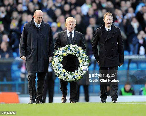 Ex Leeds United players Gary McAllister, Gordon Strachan and David Batty lay a wreath prior to kick off during the npower Championship match between...
