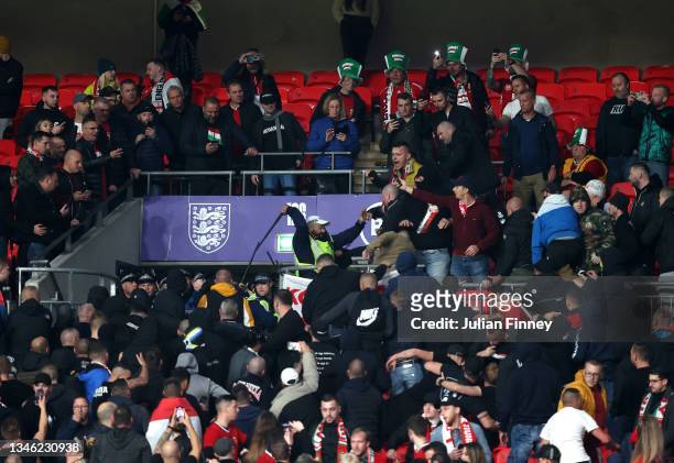 Fans of Hungary clash with police during the 2022 FIFA World Cup Qualifier match between England and Hungary at Wembley Stadium on October 12, 2021...