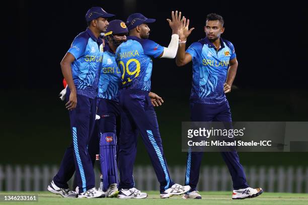 Dasun Shanaka of Sri Lanka celebrates after taking the wicket of Mushfiqur Rahim of Bangladesh pulls a delivery to the legside boundary during the...