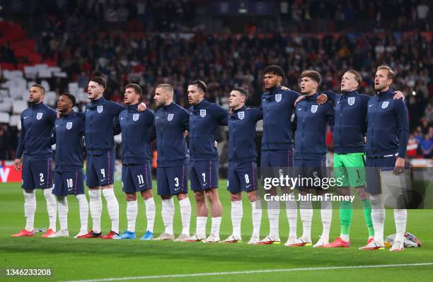 Players of England line up for the national anthem prior to the 2022 FIFA World Cup Qualifier match between England and Hungary at Wembley Stadium on...