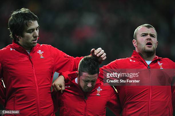 Wales wing Shane Williams sheds a tear during the national anthem flanked by Ryan Jones and Scott Andrew before the Test match between Wales and the...