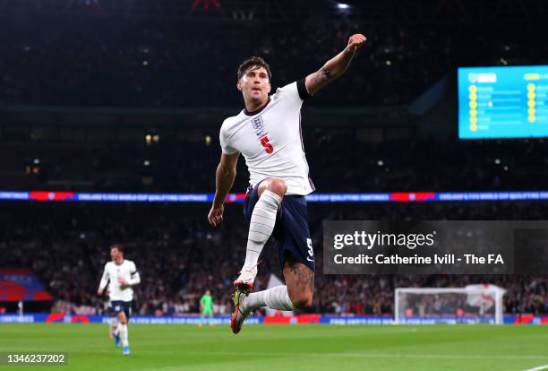 John Stones of England celebrates after scoring their team's first goal during the 2022 FIFA World Cup Qualifier match between England and Hungary at...