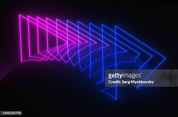 abstract triangular arrows from neon in a dark room. - glowing lines stock pictures, royalty-free photos & images