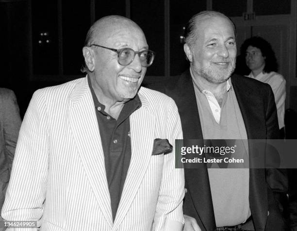 Turkish-American businessman, songwriter and philanthropist Ahmet Ertegun and American record executive Doug Morris pose for a portrait circa 1994 at...